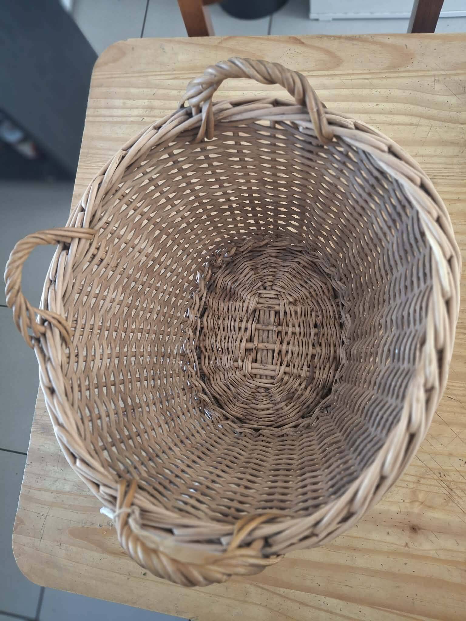 Old wicker basket with 3 handles.