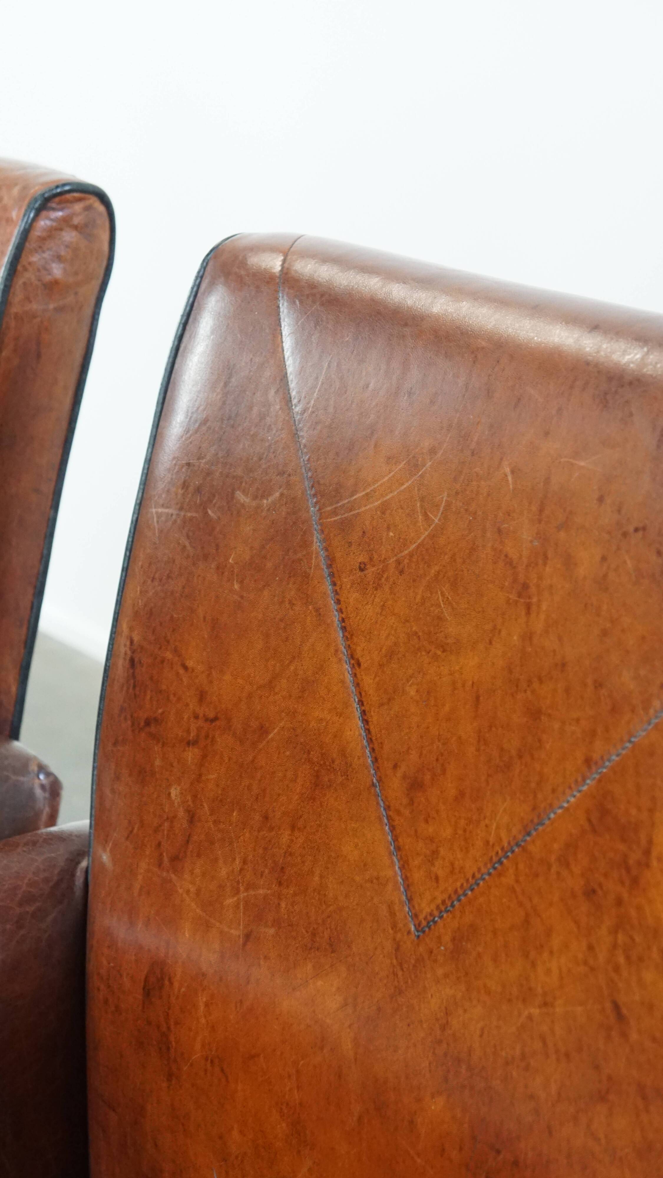 Vintage set of 4 sheepskin leather dining chairs on castors