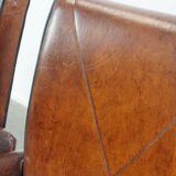 Vintage set of 4 sheepskin leather dining chairs on castors