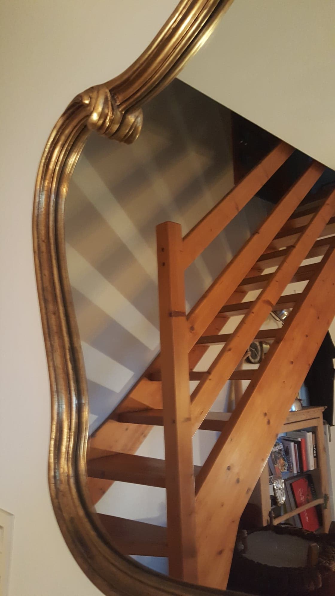 Mirror with golden mouldings