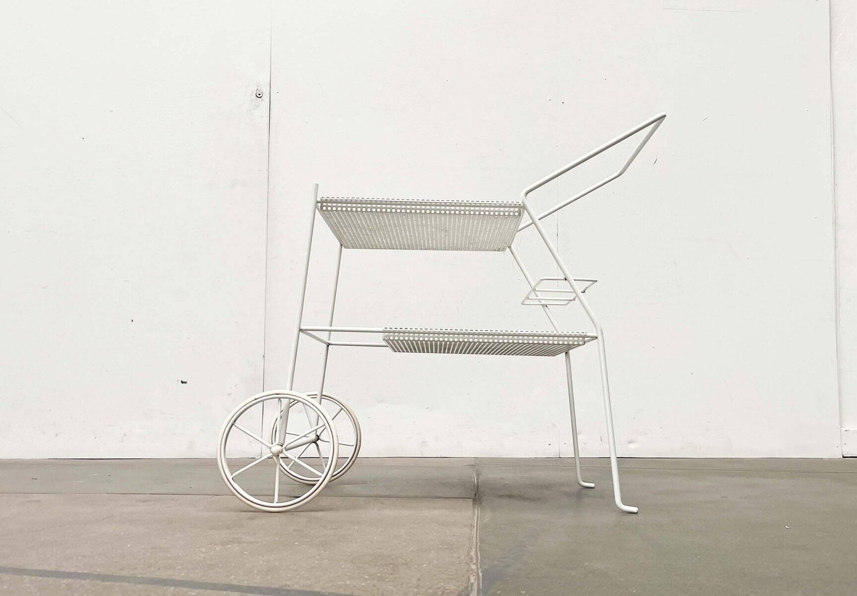 Mid-century modern minimalist perforated metal bar cart from the 1960s.