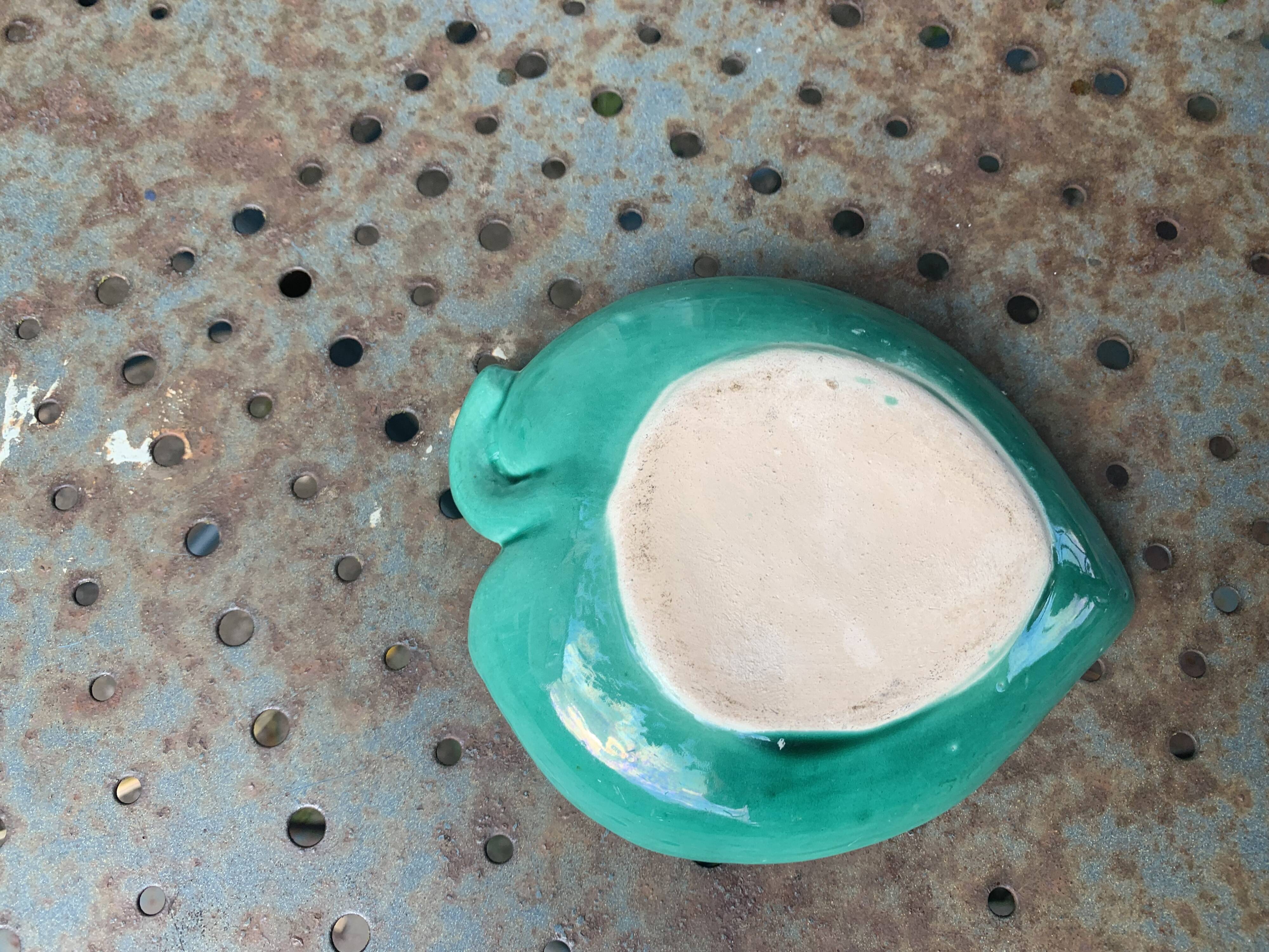 Empty pocket, duck soap dish on green barbotine leaf vintage