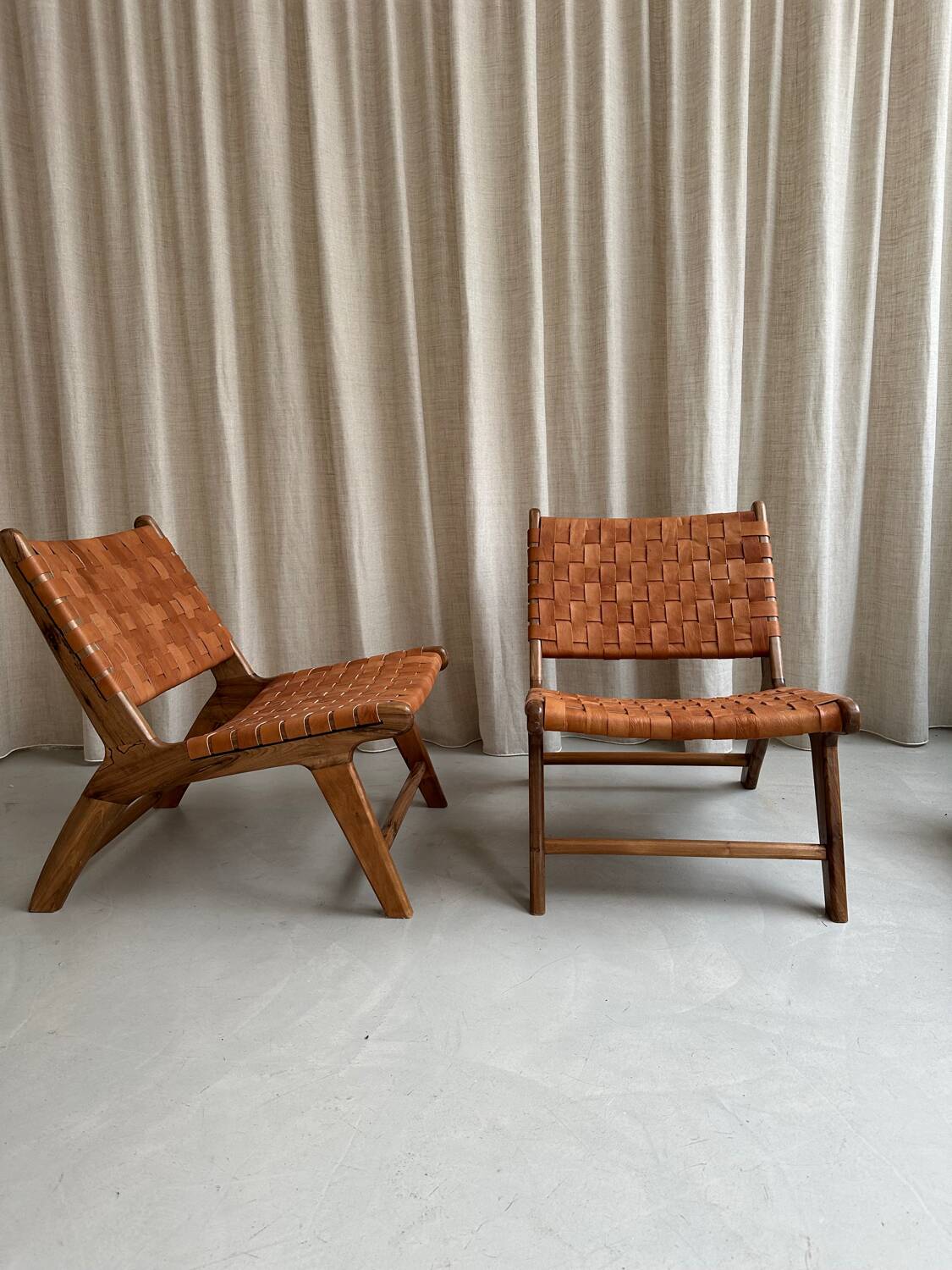 Pair of leather and walnut armchairs