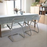 Lot of 2 chrome metal chairs by Gastone Rinaldi.