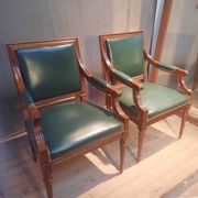 Pair of Louis XVI style armchairs upholstered in green leather.