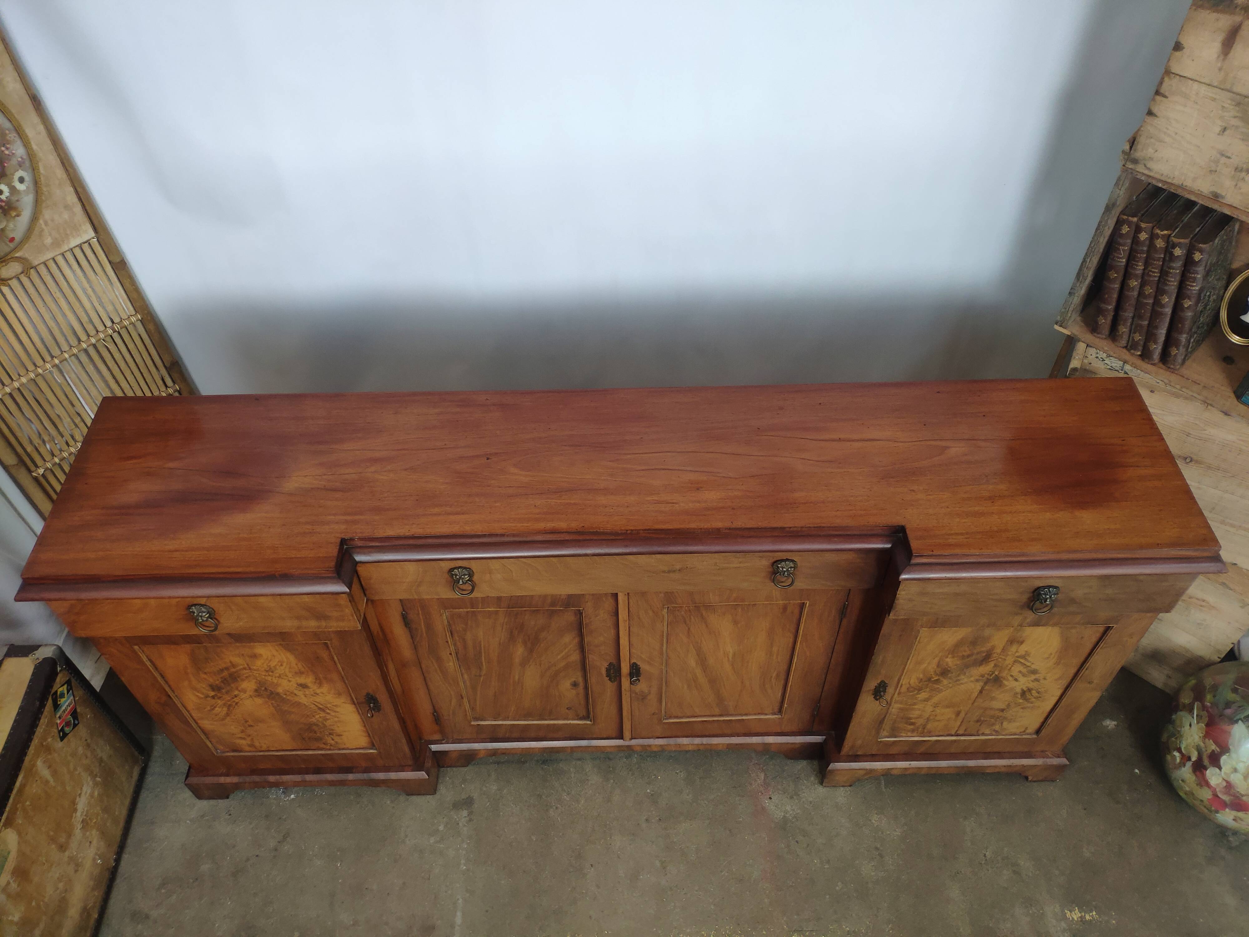 Walnut 4-door lion head sideboard
