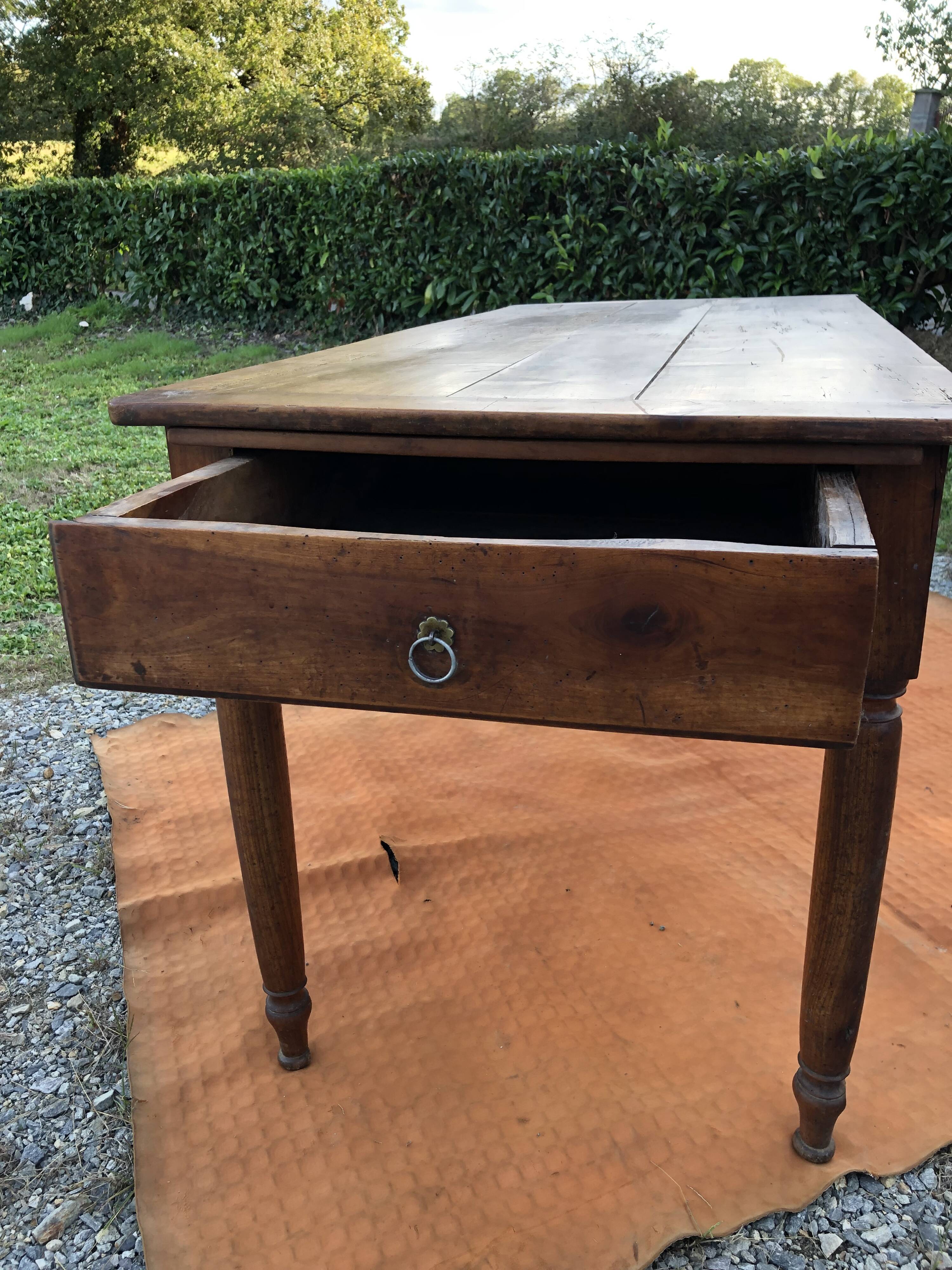 Antique cherry wood farm table with turned base with 2 drawers and 1 pull