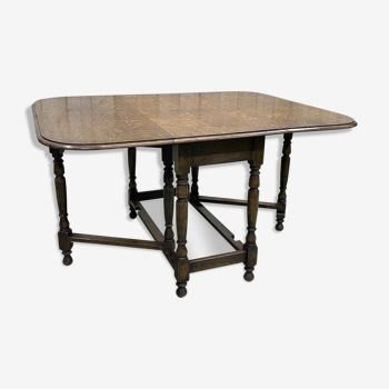 Table pliante anglaise appelée -Gateleg- en chêne des années 30