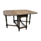 Table pliante anglaise appelée -Gateleg- en chêne des années 30