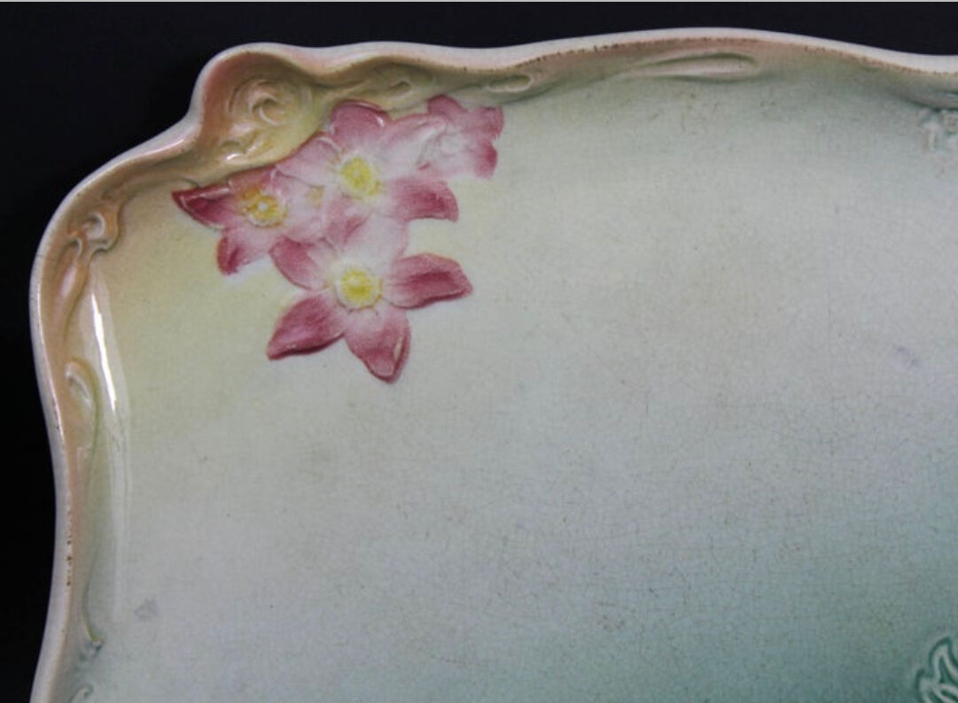 Art Nouveau plate in earthenware decorated with green and pink flowers 1900