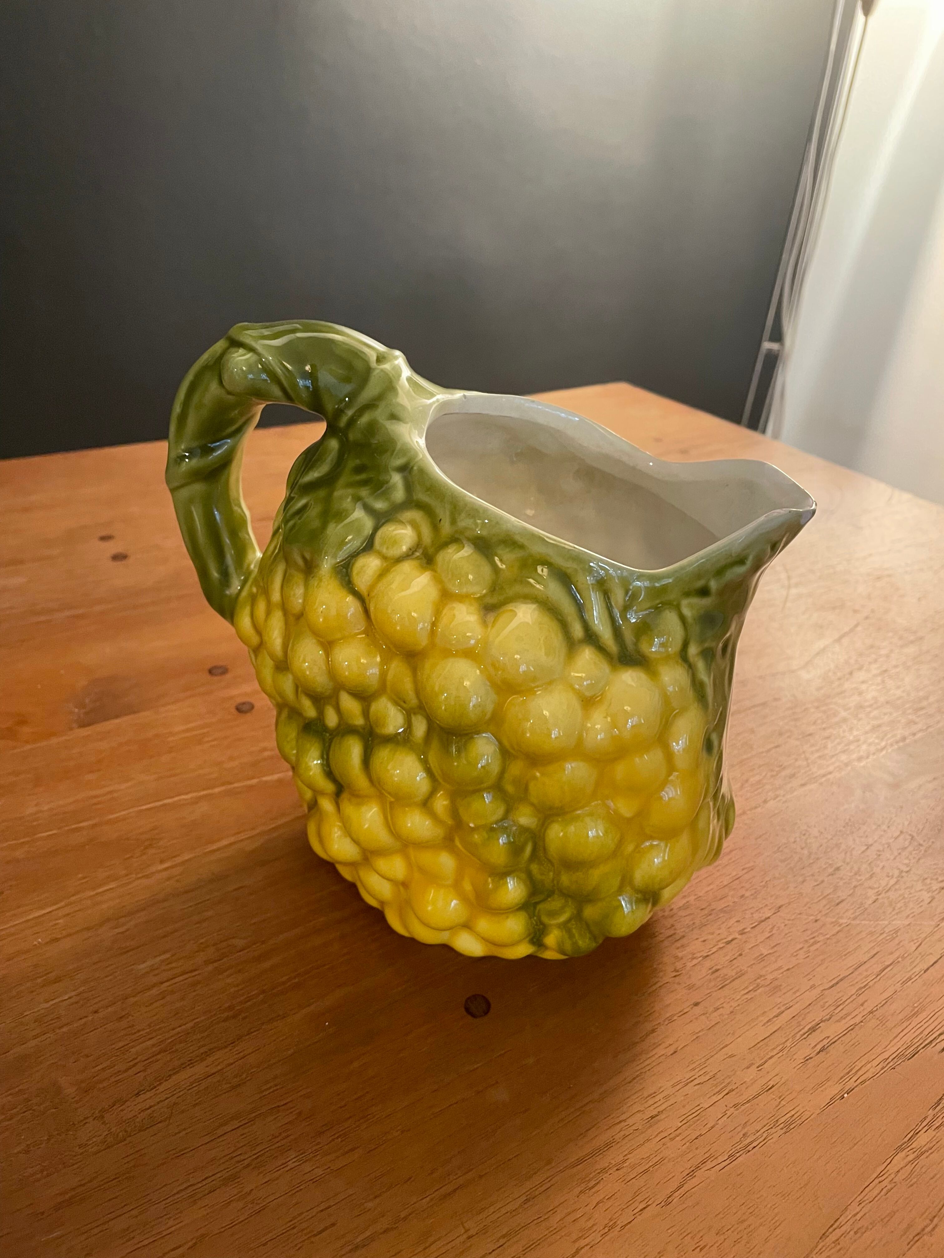 Pitcher bunch yellow and green grape slurry