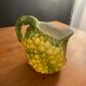 Pitcher bunch yellow and green grape slurry