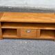 Solid pine wood TV unit stained with drawer and storage.