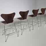 Set of 4 brown oak plywood bar stools by Fritz Hansen Series 7 by Arne Jacobsen.