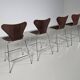 Set of 4 brown oak plywood bar stools by Fritz Hansen Series 7 by Arne Jacobsen.