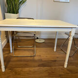 Farm table with a cream patina.