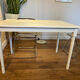 Farm table with a cream patina.