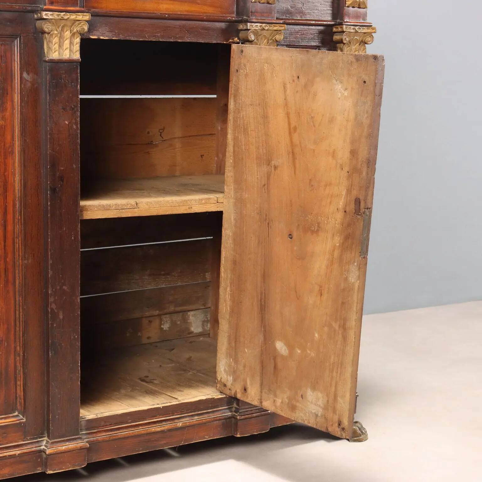 Antique walnut and fir wardrobe with drawers, Italy, 18th century.