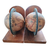 Pair of vintage bookends with rotating terrestrial globes on wooden bases in Spain
