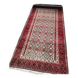 Oriental carpet knotted with red hand