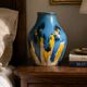 Baluster vase in Belgian ceramic with flowing blue and yellow glazes.