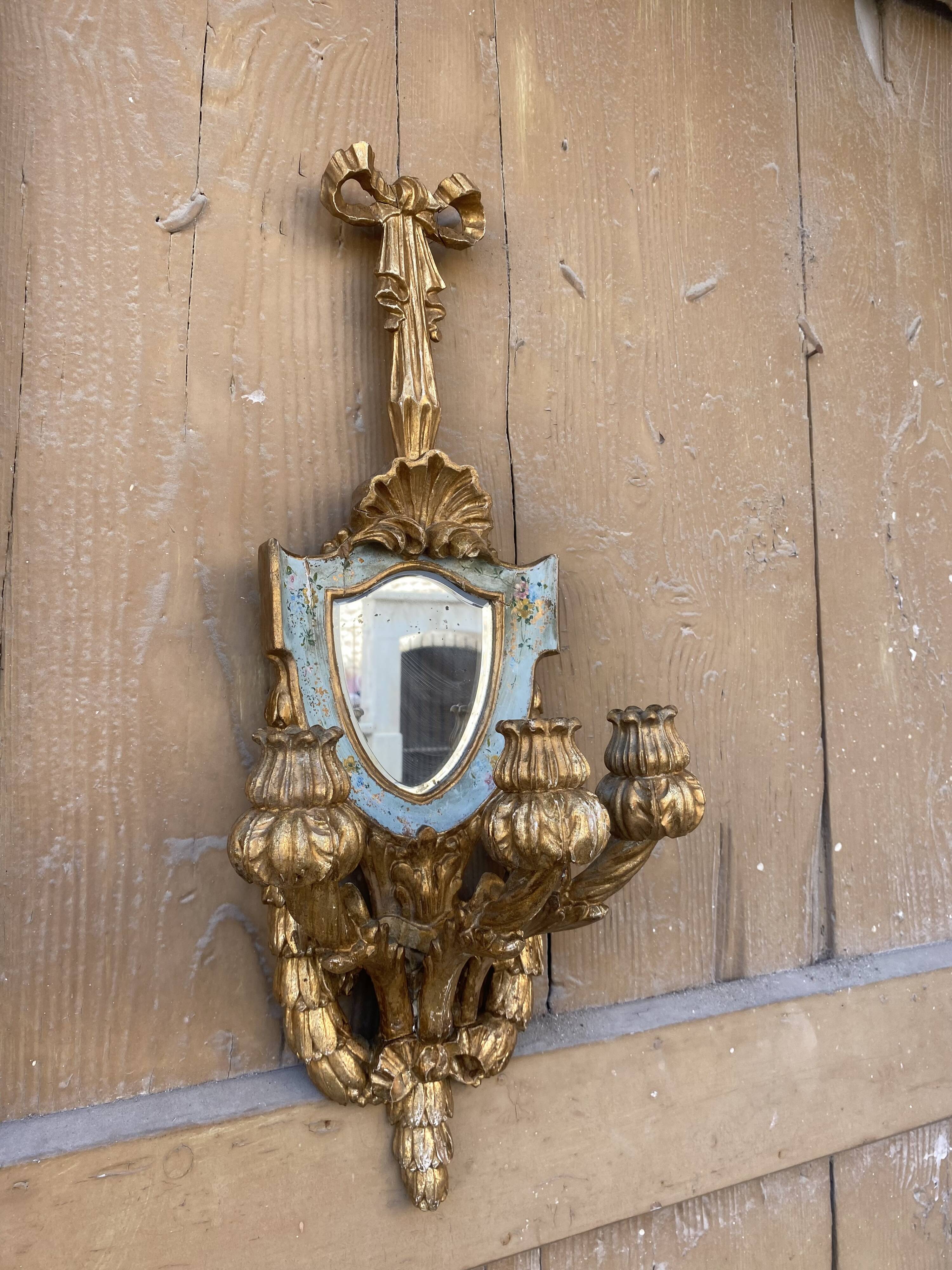 Pair of carved wood sconces