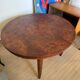 Oval extendable dining table in wood and walnut burl veneer.