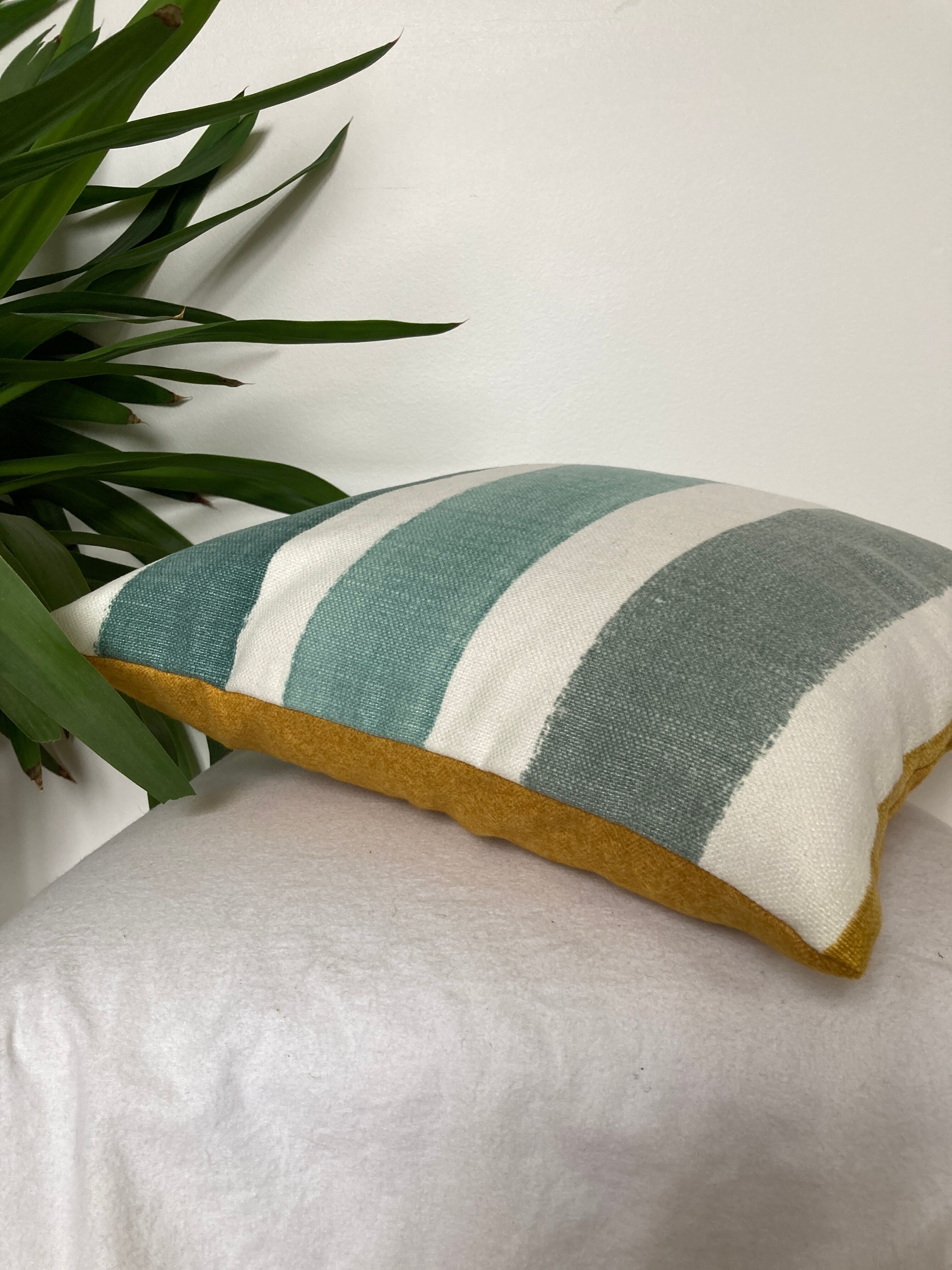 Two-sided stripe cushion solid green tones mustard