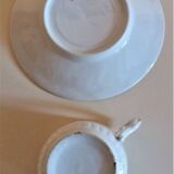 Porcelain cup and sub-cup decorated with daisies 1900