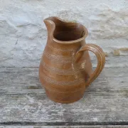 Old stoneware wine jug with patterns