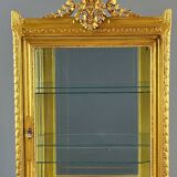 Carved and gilded wooden display cabinet, Louis XVI style, 20th century.
