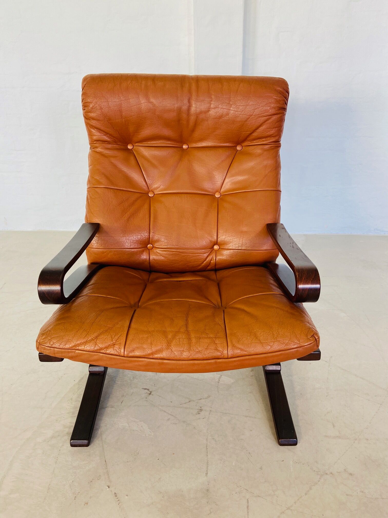 Vintage Scandinavian cognac lounge chair by Oddvin Rykken