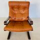 Vintage Scandinavian cognac lounge chair by Oddvin Rykken