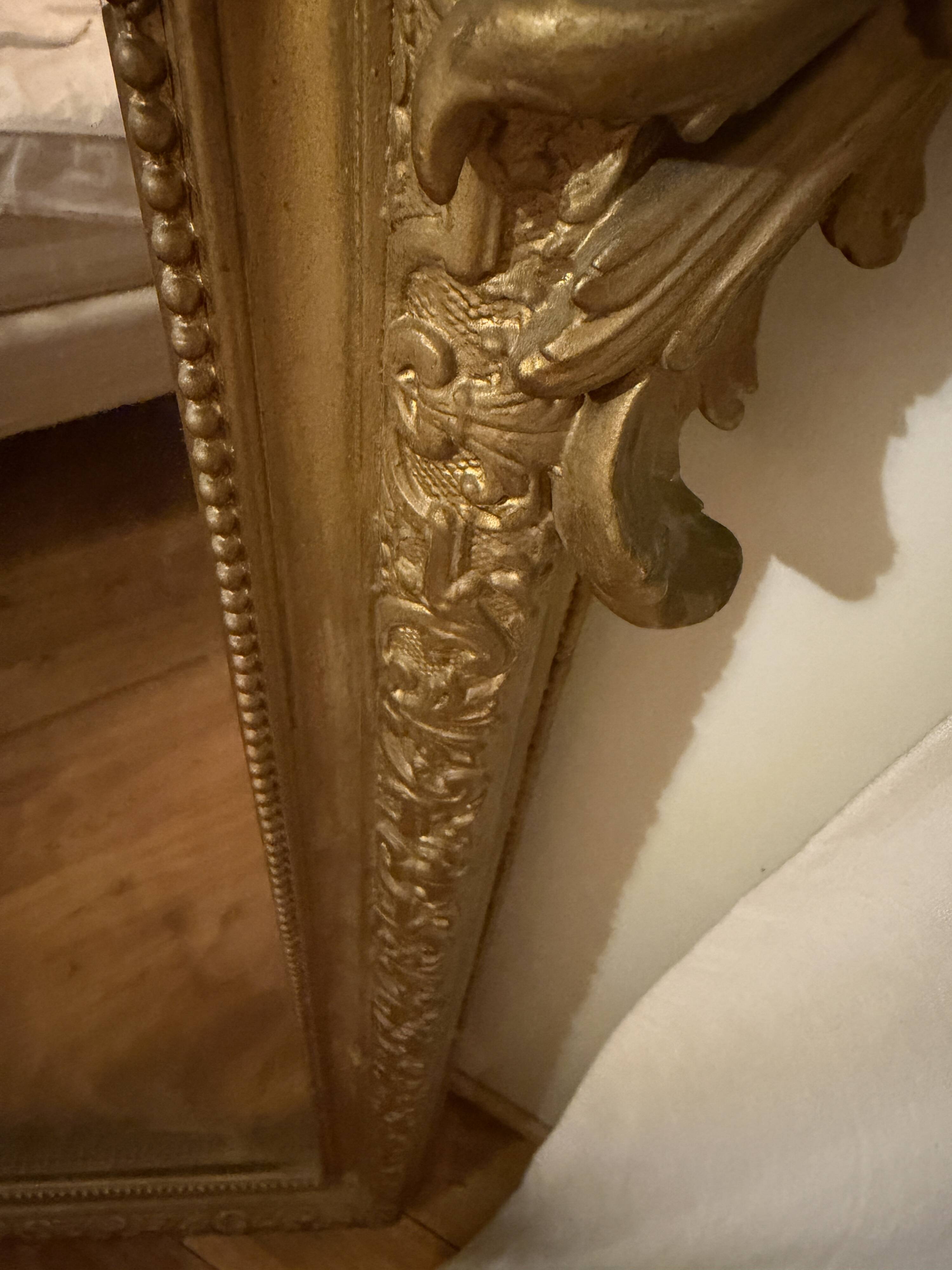 Antique gilded mirror from the late 19th century.