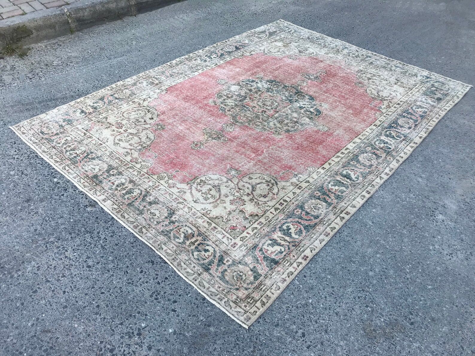 Pale pink rug with medallion
