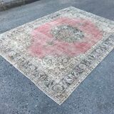 Pale pink rug with medallion