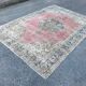 Tapis rose pâle avec médaillon