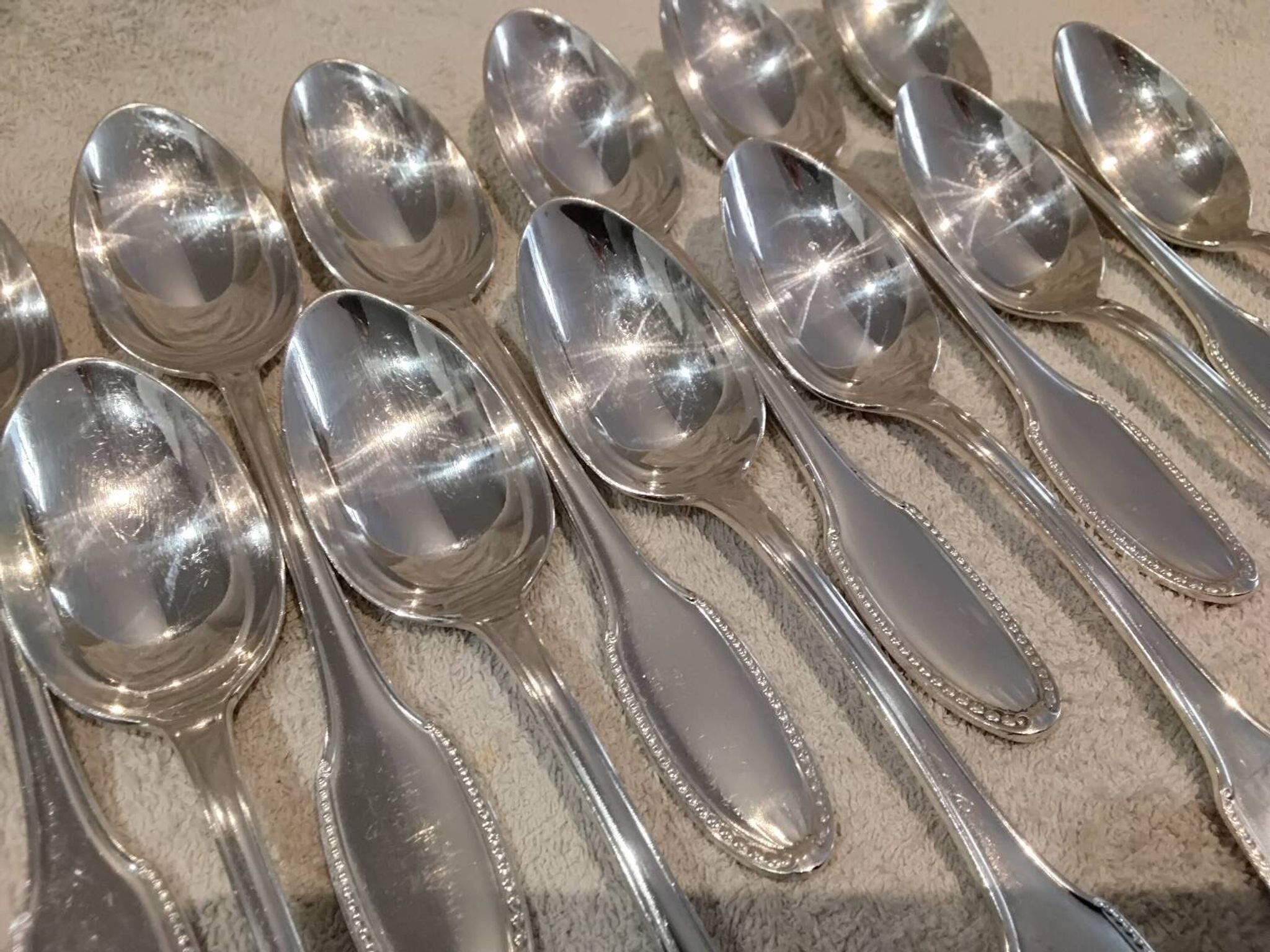 12 silver plated dessert spoons, goldsmith Alfenide, St LXVI pearls