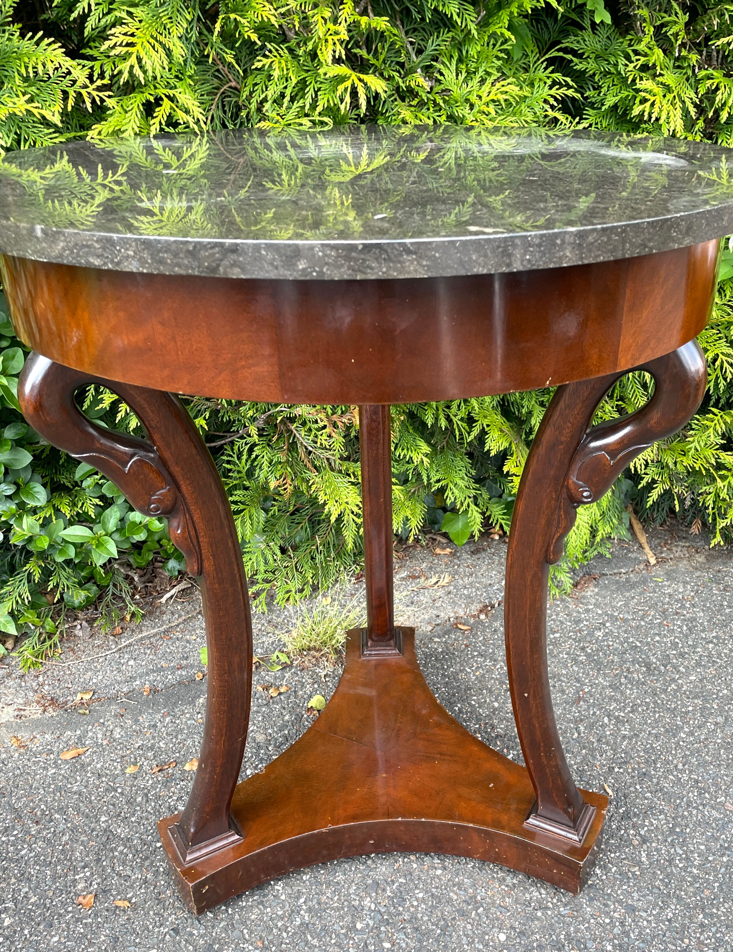 Empire style pedestal table with gooseneck, marble top.