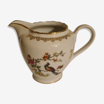 Royal porcelain milk jug with floral and peacock decoration