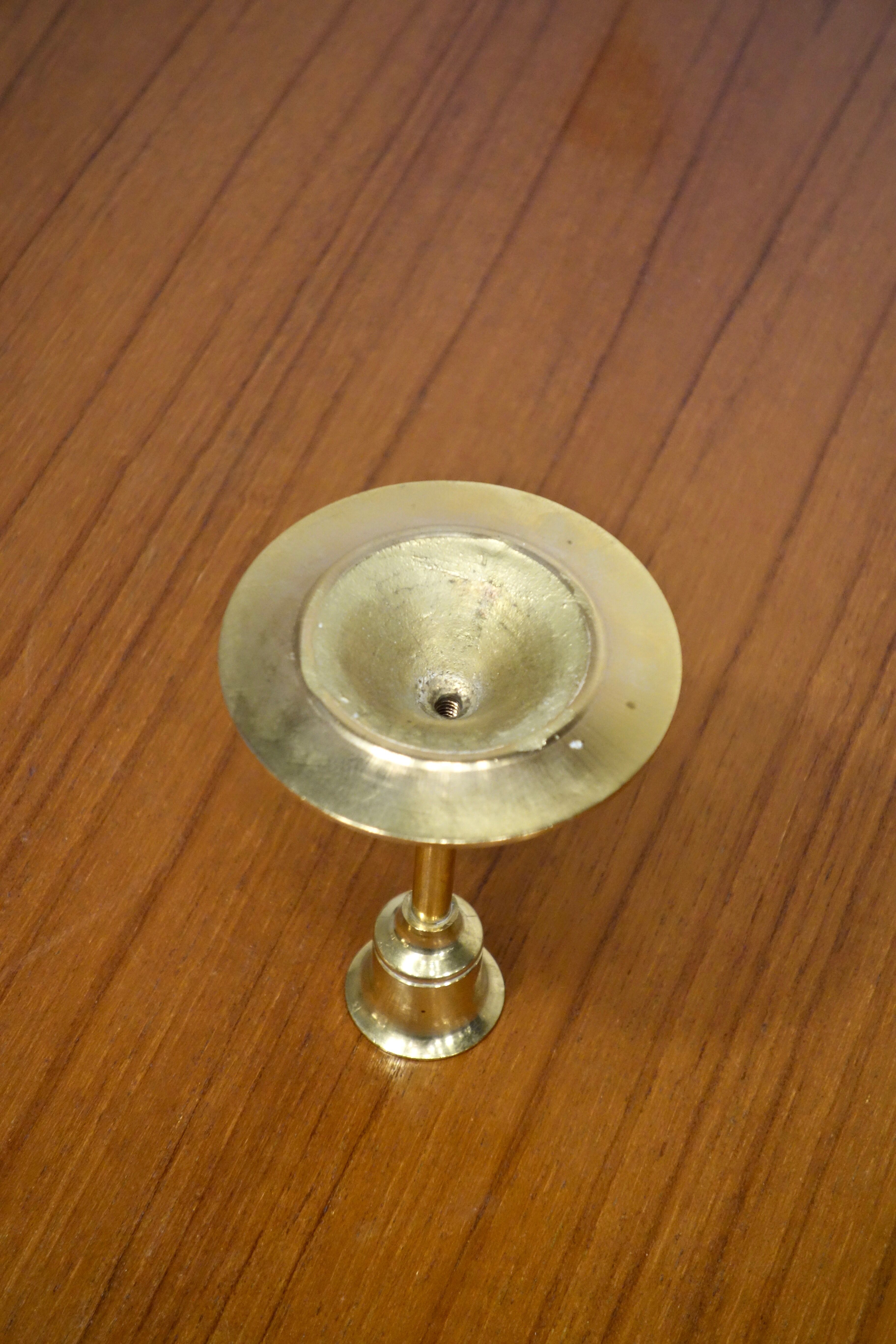 Set of 7 Scandinavian brass candle holders, 1960's