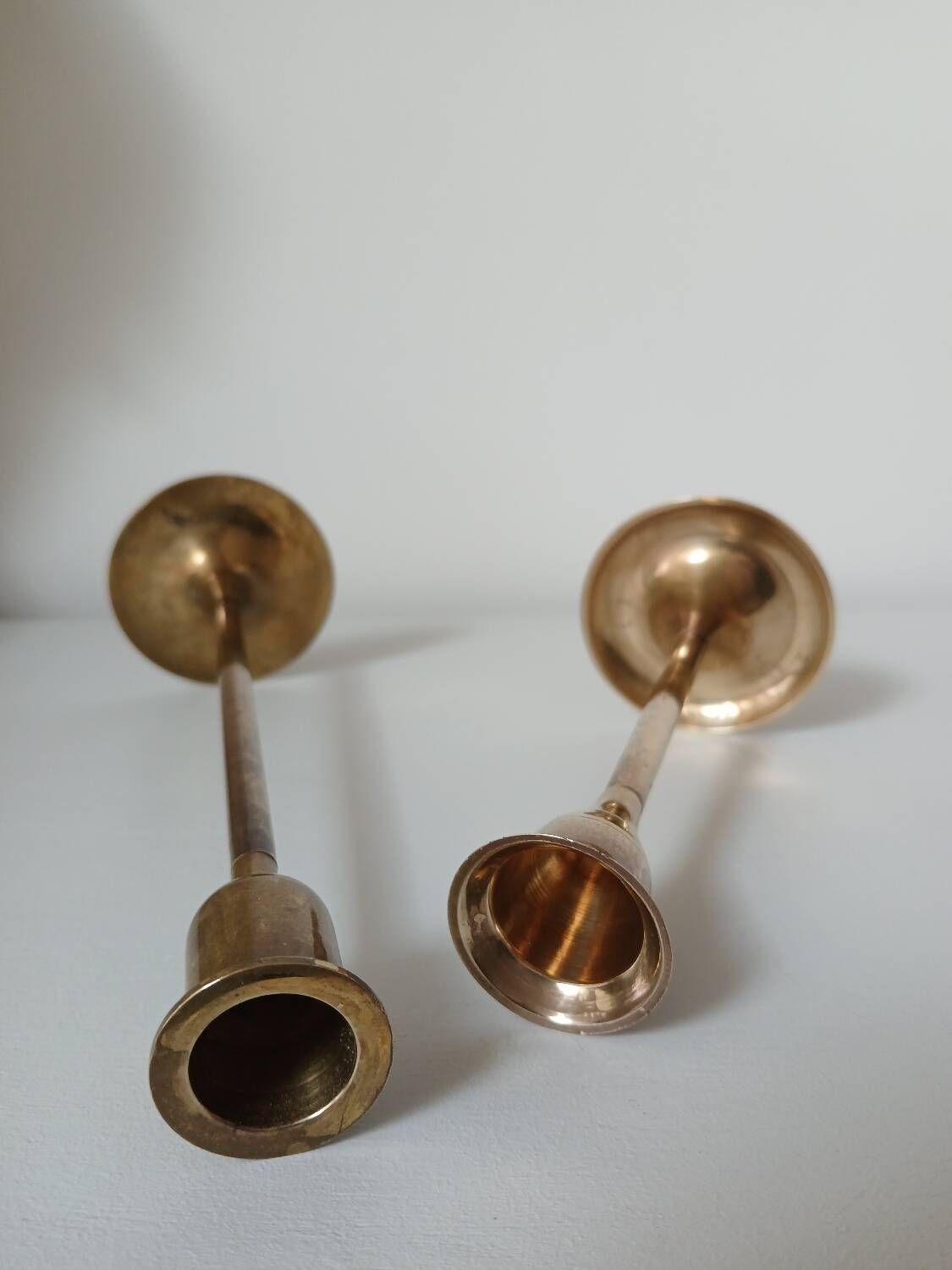 Set of two straight brass candlesticks.