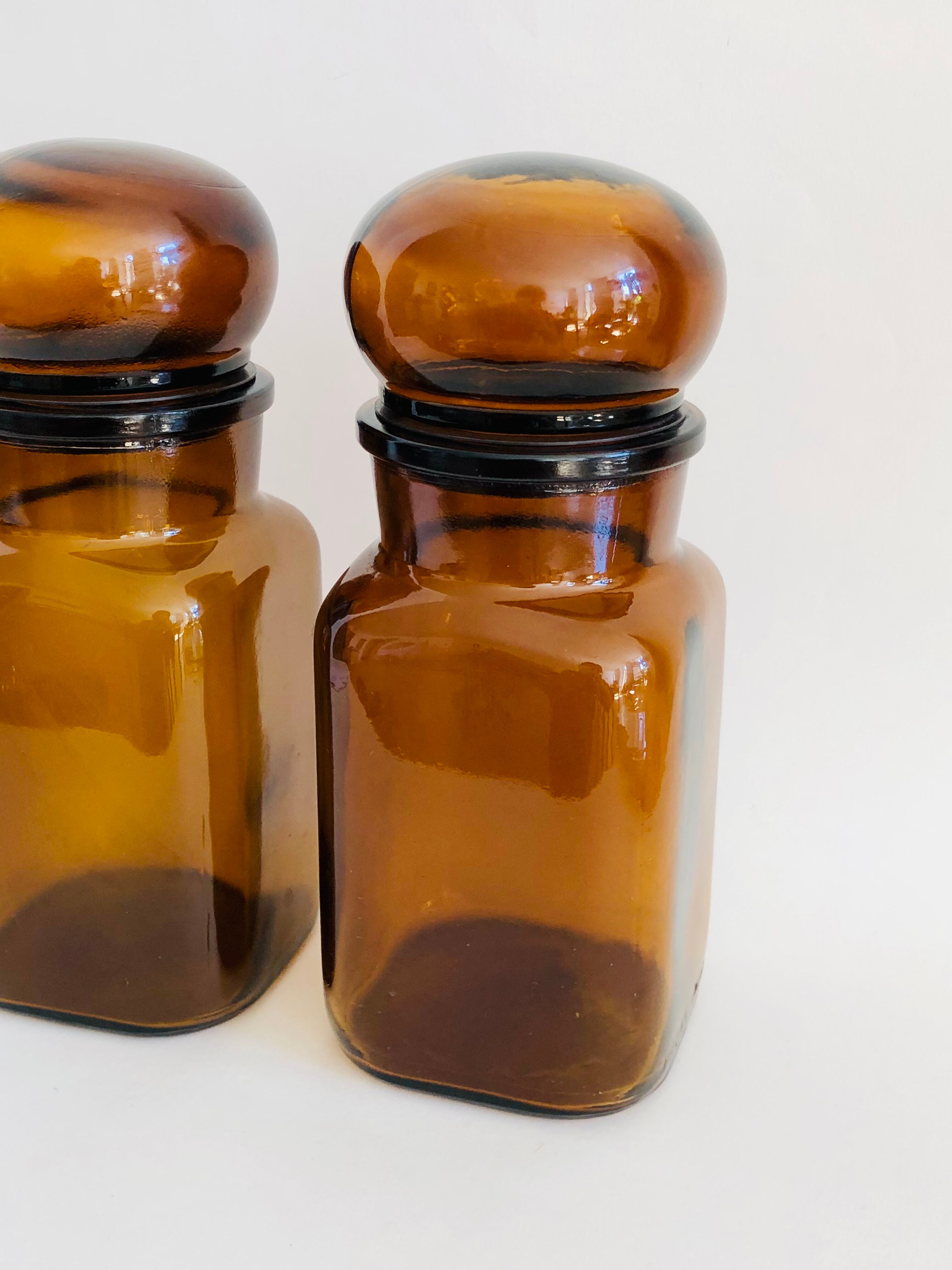 Pair of vintage amber glass jars