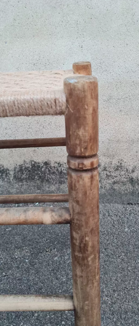 Vintage handmade wooden stool and rope