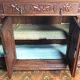 Art Nouveau buffet in carved oak with grapevine cluster decoration.