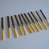 11 antique 19th-century table knives with ivory-colored monogram handles