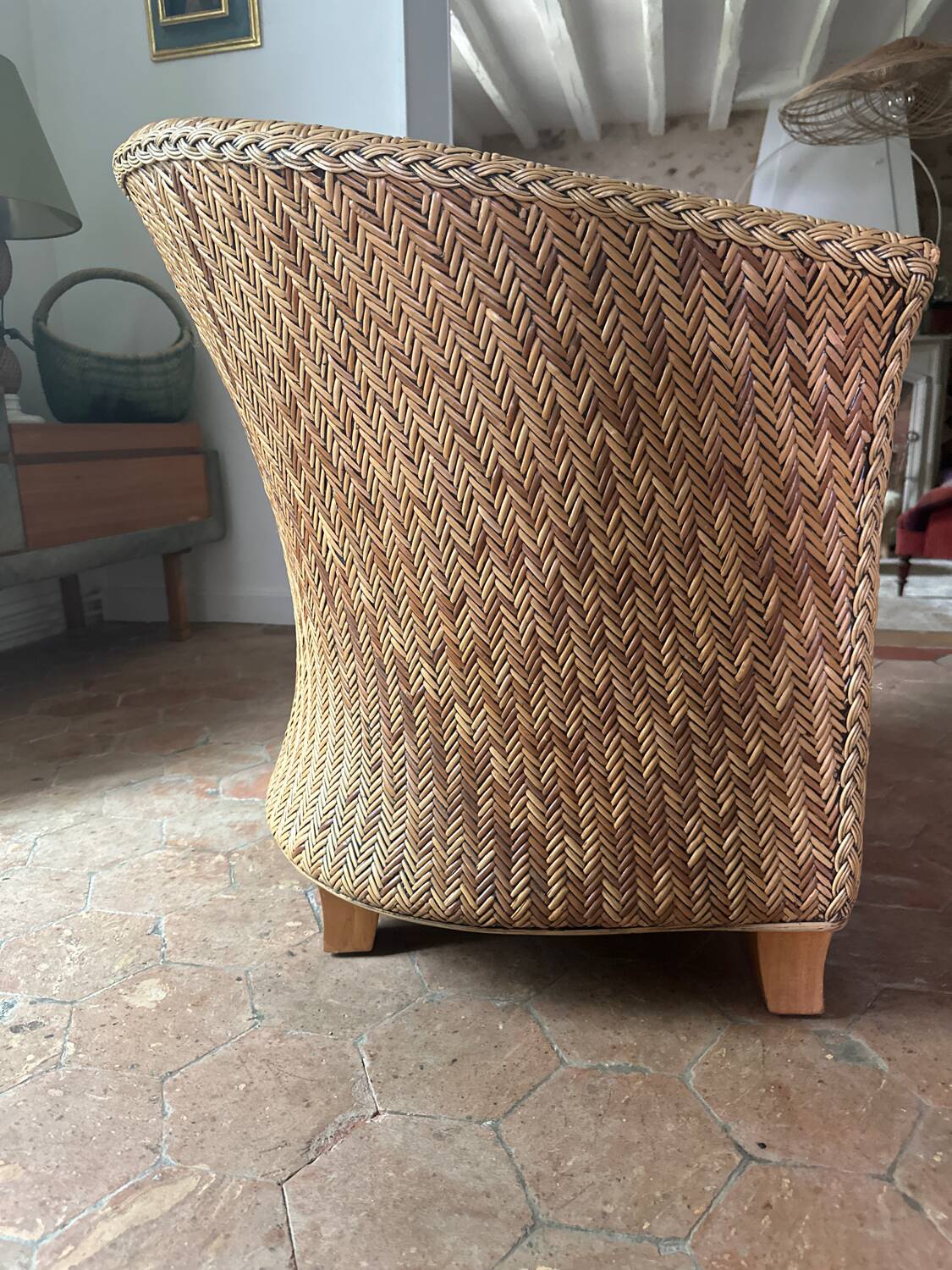 Varnished rattan armchair