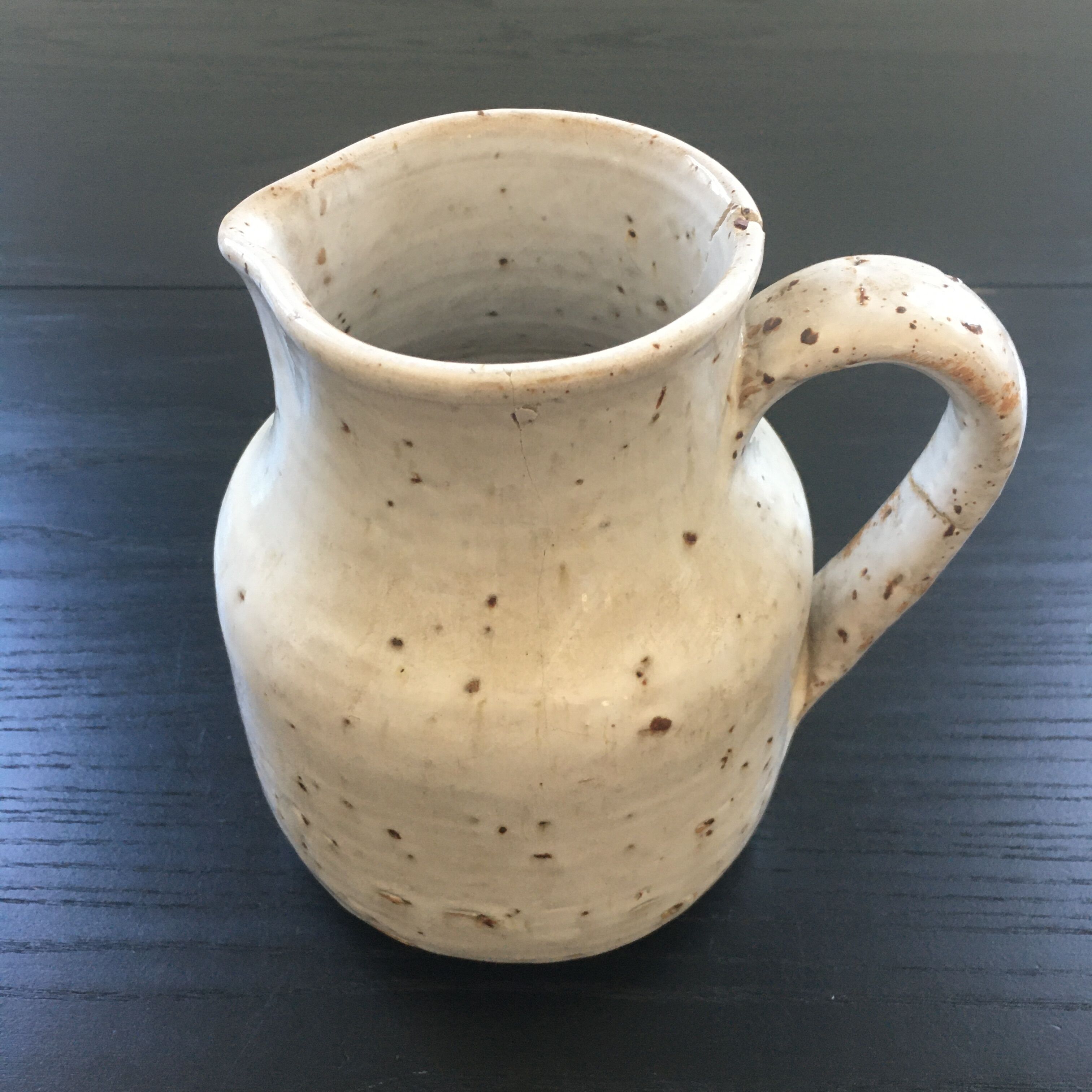Old ivory stoneware jug
