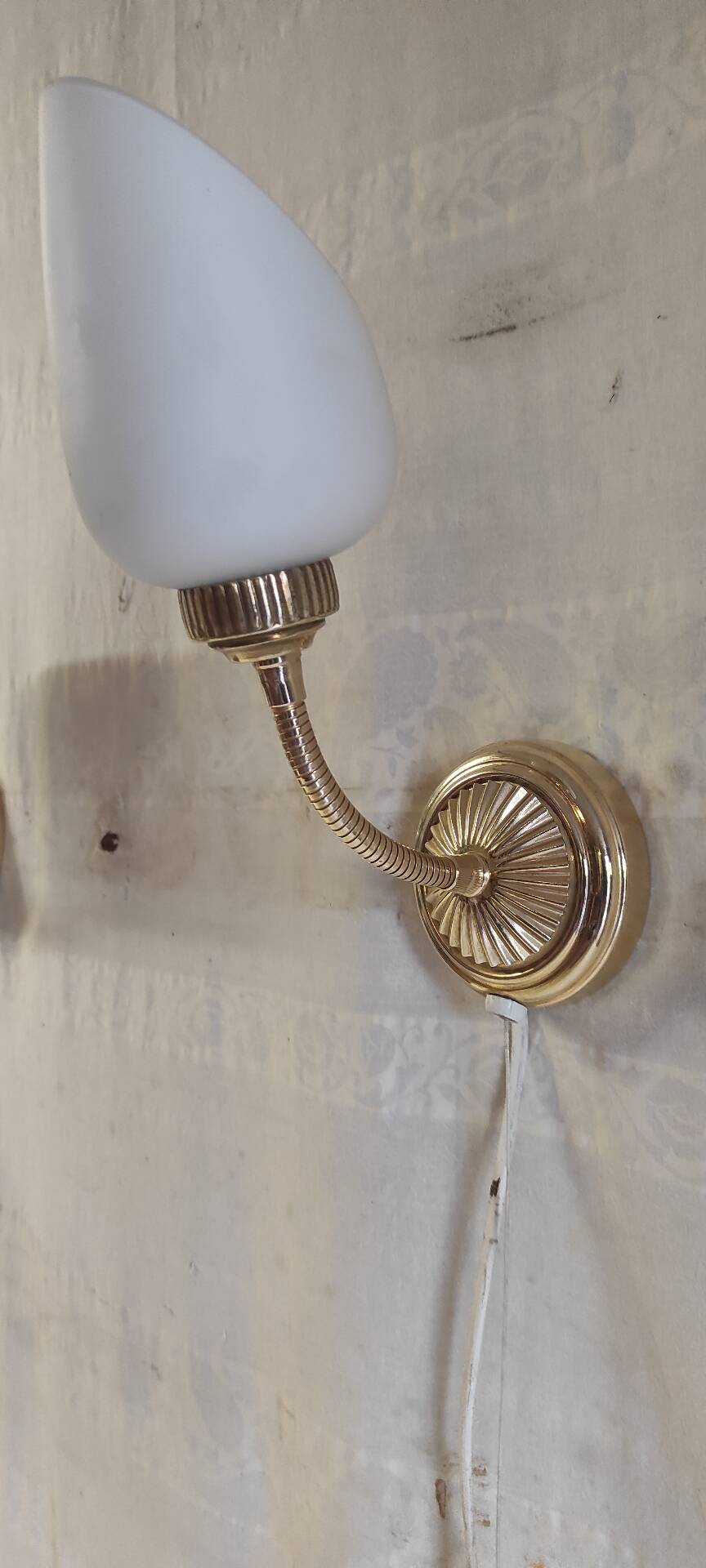 Articulated brass and opaline wall lights - mid 20th century.