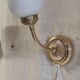 Articulated brass and opaline wall lights - mid 20th century.